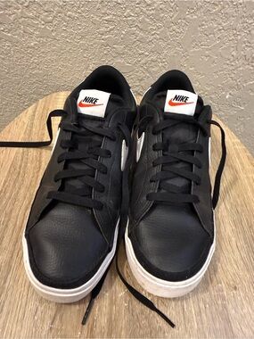 Nike Black and White Low Top Sneakers with Orange Swoosh